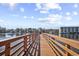 Charming boardwalk perspective with wooden railing and a view of the calm river and waterfront properties at 1525 Lanterns Rest Rd. # 304, Myrtle Beach, SC 29579