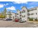 Exterior view of the condo building with ample parking and landscaped grounds at 1525 Lanterns Rest Rd. # 304, Myrtle Beach, SC 29579
