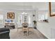 Bright dining area featuring a glass table, bay windows, and adjacent breakfast bar at 1525 Lanterns Rest Rd. # 304, Myrtle Beach, SC 29579