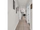 Hallway has tile flooring and leads to the living room with neutral decor at 1525 Lanterns Rest Rd. # 304, Myrtle Beach, SC 29579