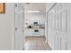 Galley kitchen with white appliances, tiled floor, and ample cabinet storage at 1525 Lanterns Rest Rd. # 304, Myrtle Beach, SC 29579