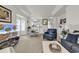 Open floor plan showcasing living and dining area with comfortable seating and natural light at 1525 Lanterns Rest Rd. # 304, Myrtle Beach, SC 29579