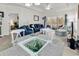 Open-concept living area connecting the dining area with a comfortable living space and a view to bedroom at 1525 Lanterns Rest Rd. # 304, Myrtle Beach, SC 29579