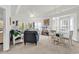 Spacious living room with multiple seating areas and a view of the balcony and dining space at 1525 Lanterns Rest Rd. # 304, Myrtle Beach, SC 29579