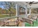 Relaxing covered patio with comfortable seating and views of the trees at 1525 Lanterns Rest Rd. # 304, Myrtle Beach, SC 29579