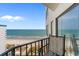 Balcony view overlooking the ocean, beach, and palm trees at 1605 S Ocean Blvd. # 1114, Myrtle Beach, SC 29577