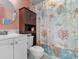 Small bathroom featuring a toilet, cabinet, and a shower with a themed shower curtain at 1605 S Ocean Blvd. # 1114, Myrtle Beach, SC 29577