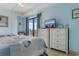 Light and airy bedroom featuring two beds, balcony access, and coastal decor at 1605 S Ocean Blvd. # 1114, Myrtle Beach, SC 29577