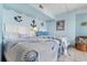 Charming bedroom with two beds, seashell bedding, and nautical accents at 1605 S Ocean Blvd. # 1114, Myrtle Beach, SC 29577
