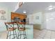 Eat-in kitchen featuring stainless steel appliances, wooden cabinetry and eat-in bar seating at 1605 S Ocean Blvd. # 1114, Myrtle Beach, SC 29577