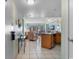 Bright living room with a view of the patio through sliding glass doors adjacent to kitchen at 1605 S Ocean Blvd. # 1114, Myrtle Beach, SC 29577