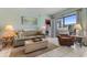 Comfortable living room featuring tile flooring, a sliding glass door to a patio, and neutral tones at 1605 S Ocean Blvd. # 1114, Myrtle Beach, SC 29577