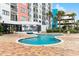 Outdoor pool with brick paver deck and view of condo building at 1605 S Ocean Blvd. # 1114, Myrtle Beach, SC 29577