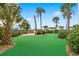 Lush putting green area, beautifully landscaped with palm trees and shrubbery at oceanfront condo complex at 1605 S Ocean Blvd. # 1114, Myrtle Beach, SC 29577