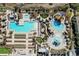 Enjoy the aerial view showing multiple pools, lounge areas, and palm trees at 180 Rothbury Circle # 203, Myrtle Beach, SC 29572