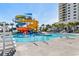 Fantastic community pool and slide in this sunny exterior shot of the amenities at 180 Rothbury Circle # 203, Myrtle Beach, SC 29572
