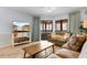 Inviting living room with TV, comfortable seating, and sliding door access to outdoor patio at 180 Rothbury Circle # 203, Myrtle Beach, SC 29572