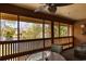 Outdoor patio with wooded, lake view and overhead fan at 180 Rothbury Circle # 203, Myrtle Beach, SC 29572