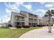 Charming condo building with multi-level balconies, screened porches, and lush landscaping at 1860 Auburn Ln. # 19E, Surfside Beach, SC 29575