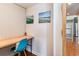 Bright home office features a built-in desk and coastal artwork at 1860 Auburn Ln. # 19E, Surfside Beach, SC 29575