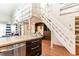 Stylish interior view highlighting the kitchen, living area, loft, and stairs at 1860 Auburn Ln. # 19E, Surfside Beach, SC 29575