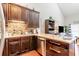 Modern kitchen featuring ample counter space and dark wooden cabinetry at 1860 Auburn Ln. # 19E, Surfside Beach, SC 29575