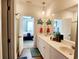 Bathroom with a double vanity and a view to the bedroom with a large bed at 187 S Reindeer Rd., Surfside Beach, SC 29575