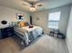 Well-lit bedroom with a ceiling fan, comfortable bed, and decoratively furnished at 187 S Reindeer Rd., Surfside Beach, SC 29575