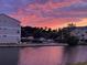 Apartment complex with lake and colorful sky at 187 S Reindeer Rd., Surfside Beach, SC 29575