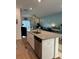 Modern kitchen island featuring granite countertops and stainless steel appliances opening up to the living area at 187 S Reindeer Rd., Surfside Beach, SC 29575
