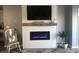 Electric fireplace with white shiplap, rustic mantel, and modern decor at 187 S Reindeer Rd., Surfside Beach, SC 29575