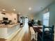 Open-concept living area with wood floors, kitchen island, and bright coastal decor at 187 S Reindeer Rd., Surfside Beach, SC 29575