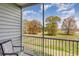 Relaxing balcony showcases a chair and a scenic view of trees and the sky at 189 Ella Kinley Circle # 203, Myrtle Beach, SC 29588