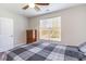 Bedroom with a ceiling fan, hardwood floors, and a bright window at 189 Ella Kinley Circle # 203, Myrtle Beach, SC 29588