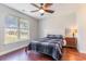 Bright bedroom features wood floors, ceiling fan and large window with natural light at 189 Ella Kinley Circle # 203, Myrtle Beach, SC 29588
