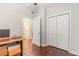 Bedroom featuring hardwood flooring, open closet, and an open doorway at 189 Ella Kinley Circle # 203, Myrtle Beach, SC 29588