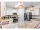 Well-equipped kitchen with granite countertops, stainless steel appliances, and white cabinets at 189 Ella Kinley Circle # 203, Myrtle Beach, SC 29588