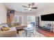 Living room with hardwood floors, a ceiling fan, sectional couch, and an outdoor view at 189 Ella Kinley Circle # 203, Myrtle Beach, SC 29588
