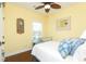 Bright bedroom with hardwood floors, a ceiling fan, and ample natural light from the window at 1965 24Th Ave. N, North Myrtle Beach, SC 29582