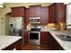 Close-up of the kitchen with stainless steel appliances, granite countertops, wood cabinets, and a sink at 1965 24Th Ave. N, North Myrtle Beach, SC 29582