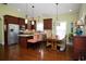 Bright kitchen with stainless steel appliances, granite countertops, stylish light fixtures, wood floors, and dining area at 1965 24Th Ave. N, North Myrtle Beach, SC 29582