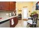 Kitchen featuring wooden cabinets, granite countertops, and a stainless steel mini fridge at 1965 24Th Ave. N, North Myrtle Beach, SC 29582