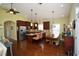 Spacious kitchen and dining area with stainless steel appliances, granite countertops, and stylish pendant lighting at 1965 24Th Ave. N, North Myrtle Beach, SC 29582