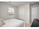 Bedroom featuring neutral walls, carpet floors, and a large window for natural light at 204 Jeff Waters Circle, Longs, SC 29568