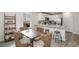 Eat-in kitchen and dining area with a view to the exterior and kitchen bar with stools at 204 Jeff Waters Circle, Longs, SC 29568