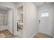 Inviting foyer featuring neutral walls, views into bedroom, and a glimpse of the bathroom at 204 Jeff Waters Circle, Longs, SC 29568