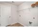 Functional laundry room with white shelving and modern utilities at 204 Jeff Waters Circle, Longs, SC 29568