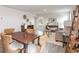 Open-concept living area with dining table, neutral decor, and lots of natural light at 204 Jeff Waters Circle, Longs, SC 29568