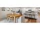 Inviting dining area with a wooden table, seating for eight, and stylish decor at 207 Calm Dr., Little River, SC 29566