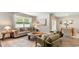 Inviting living room with a cozy sofa, stylish armchairs, and plenty of natural light at 207 Calm Dr., Little River, SC 29566